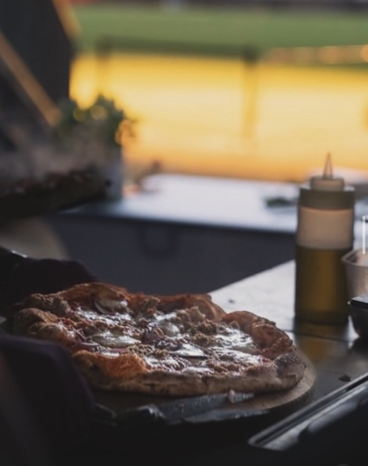 Pizza being prepared at an 8Hundred event